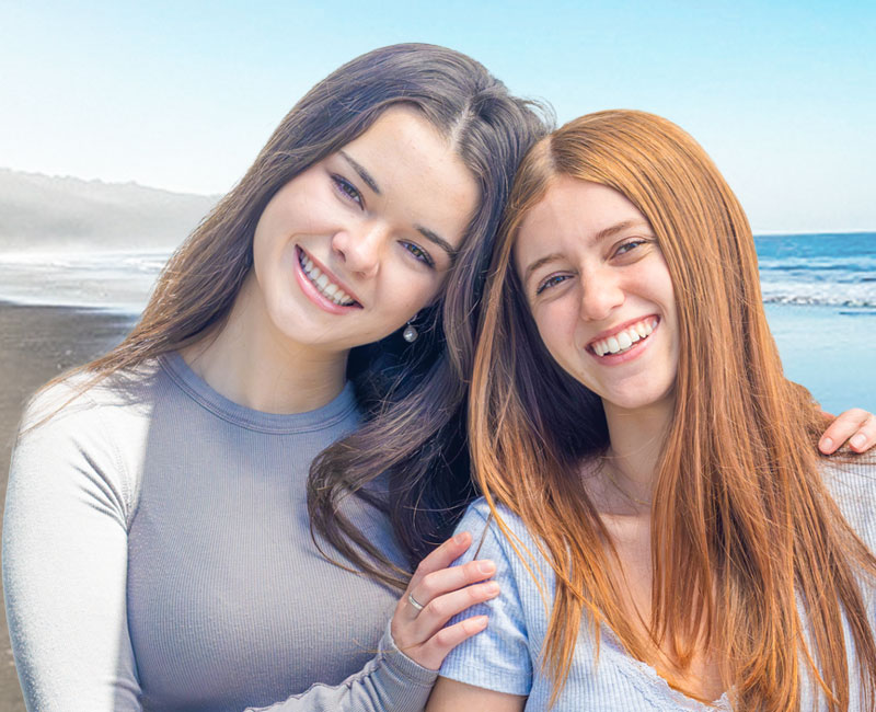 Aya and friend by the coast.